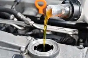 Engine Oil Guide: Adding Fresh Oil Through Top of Valve Cover Opening